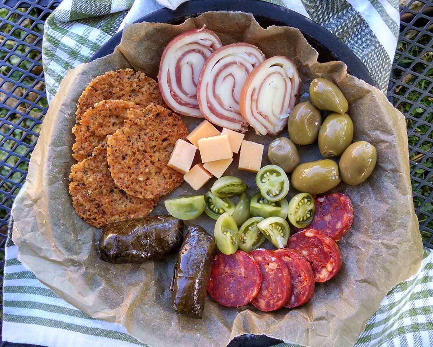Charcuterie board with pickled green tomatoes