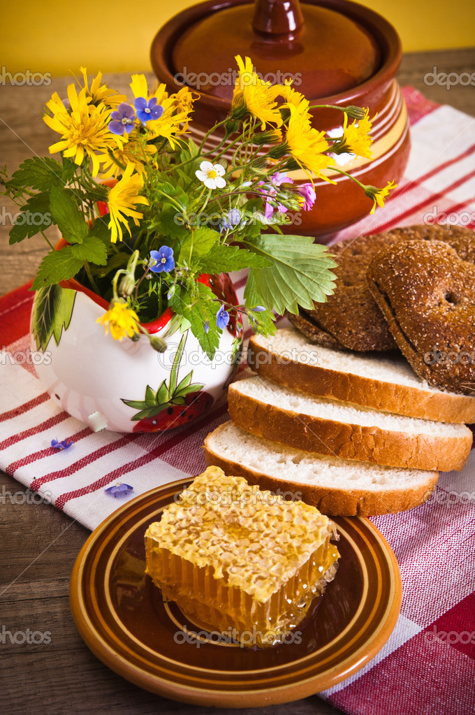 depositphotos 38759635 stock photo still life with honeycombs flowers