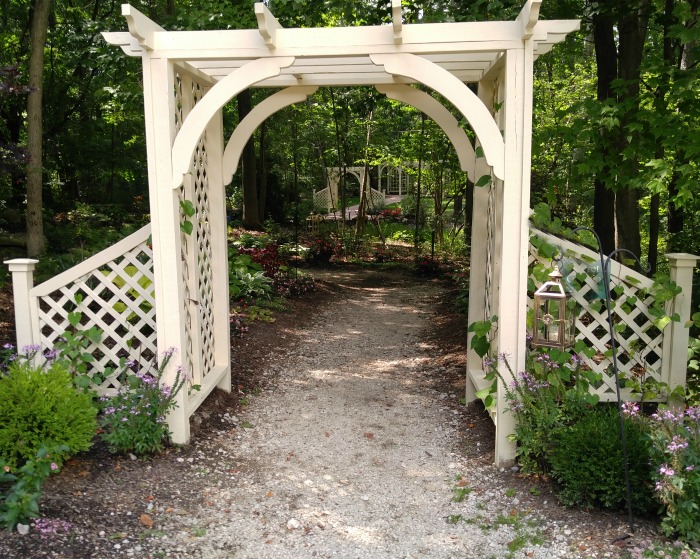 Traditional white arbor from Beech Creek Botanical Gardens.