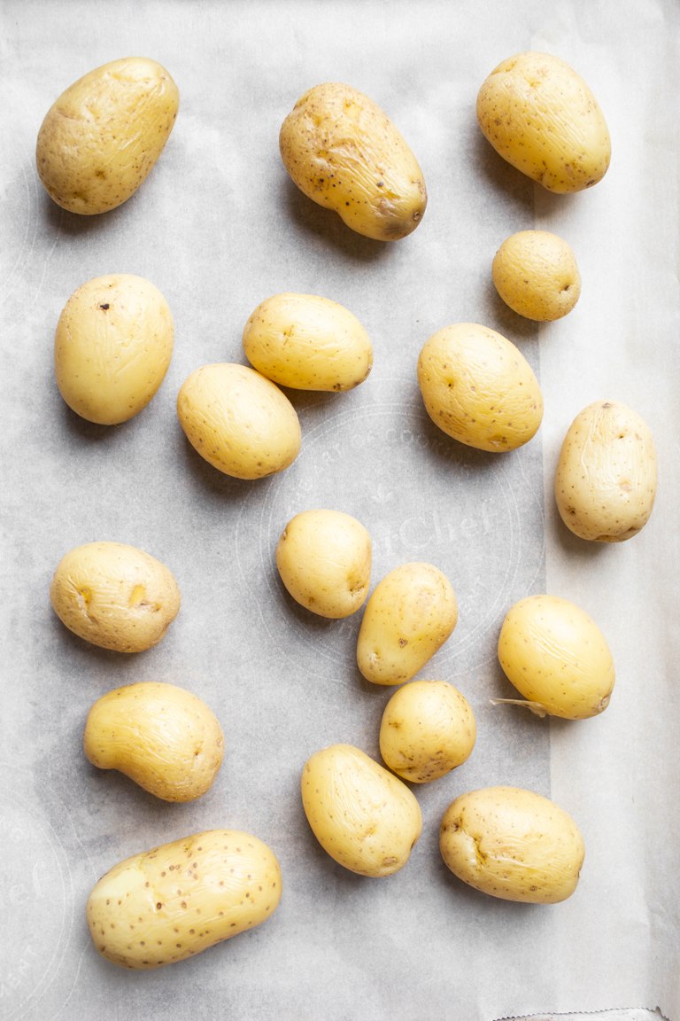 baby gold potatoes on parchment paper lined pan