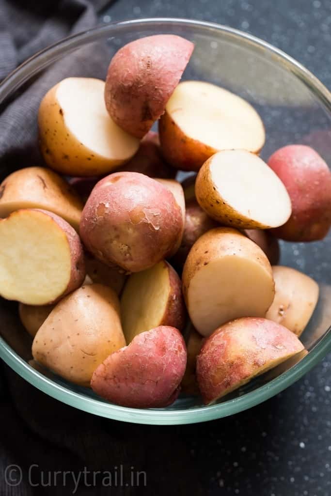 cut red skin and yellow skin potatoes in glass bowl for instant pot potatoes roast