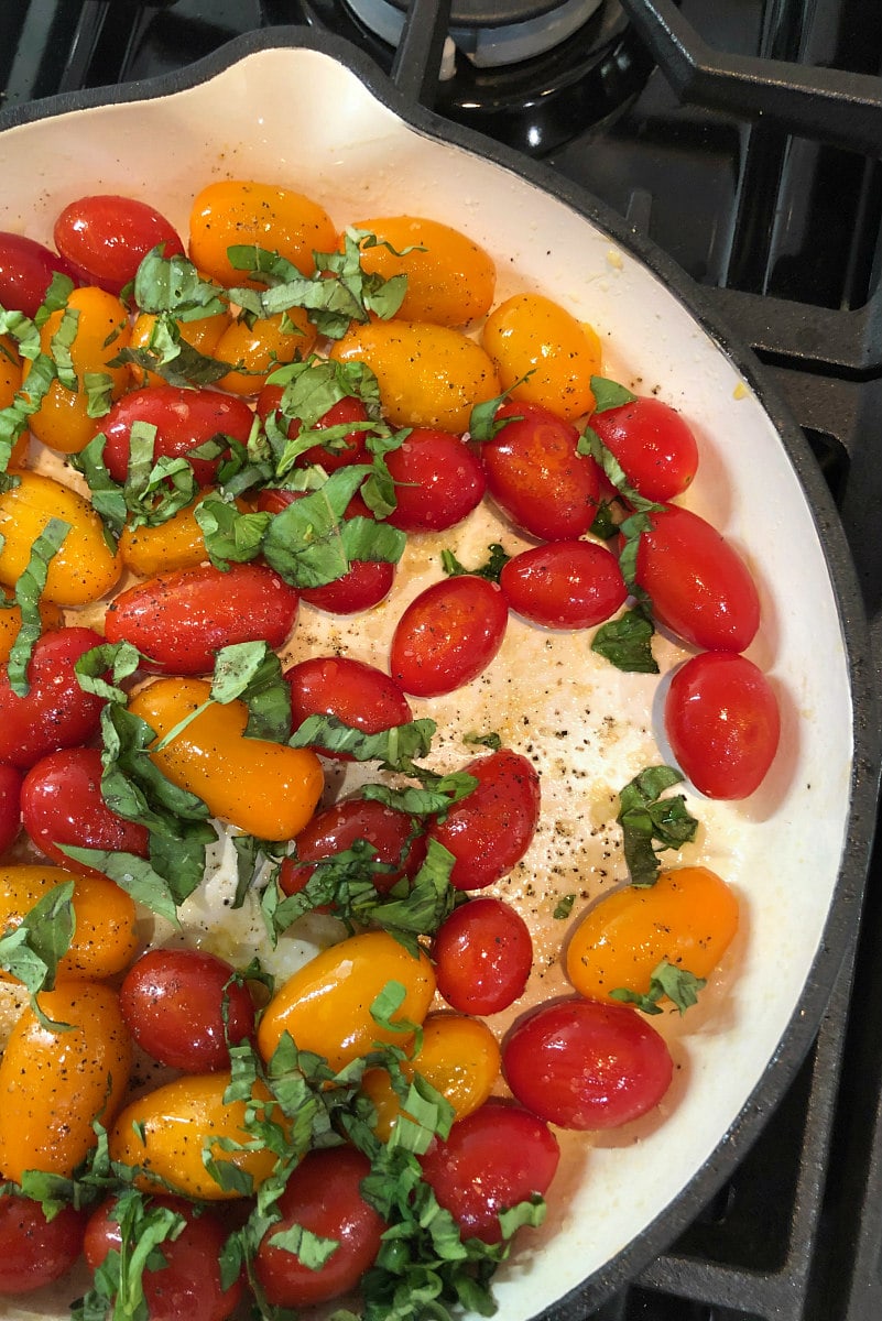 Sauteed Cherry or Pear Tomatoes with basil and garlic recipe from RecipeGirl.com #sauteed #cherry #tomatoes #pear #cherrytomatoes #peartomatoes #fresh #basil #garlic #recipe #RecipeGirl sauteed cherry tomatoes in the pan