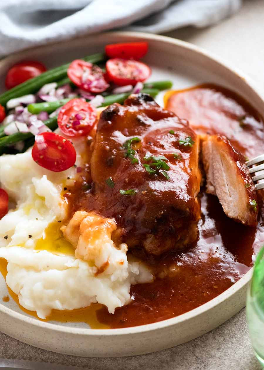 Oven Baked Barbecue Chicken with homemade Barbecue Sauce dinner plate - mashed potato and green bean salad on the side